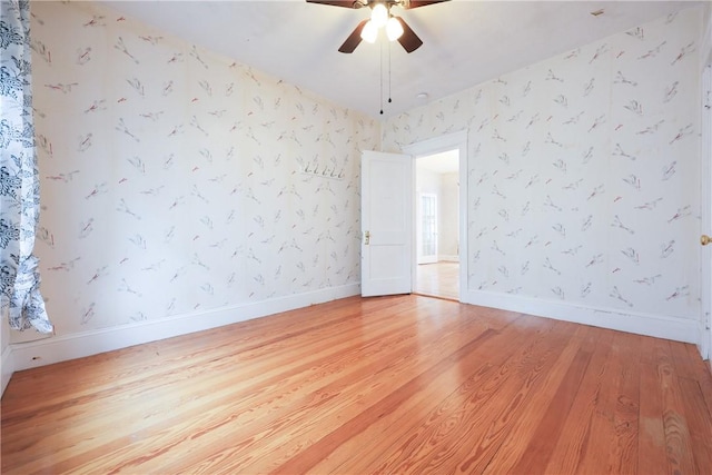 162 Rand St, Central Falls, RI 02863 - unfurnished room featuring light wood-style floors, wallpapered walls, and ceiling fan