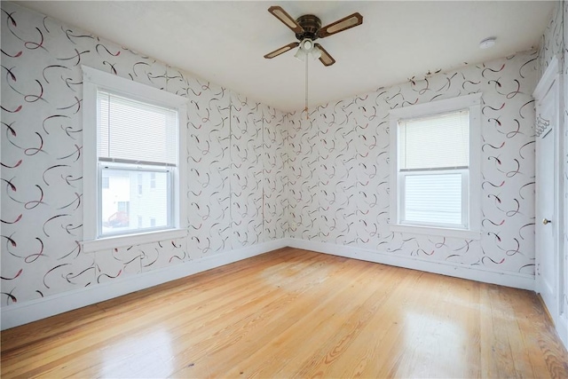 162 Rand St, Central Falls, RI 02863 - unfurnished room featuring wood finished floors, ceiling fan, and a smoke detector