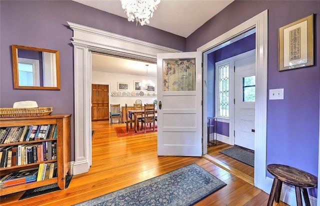179 Elmgrove Ave, Providence, RI 02906 - entryway featuring a chandelier and wood-type flooring