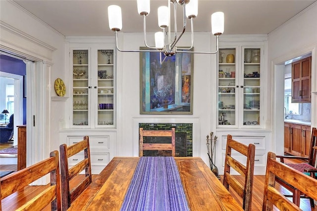 179 Elmgrove Ave, Providence, RI 02906 - dining room featuring a chandelier, ornamental molding, and healthy amount of natural light
