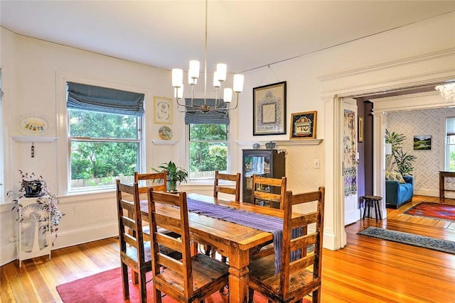 179 Elmgrove Ave, Providence, RI 02906 - dining room with a chandelier and light wood-type flooring