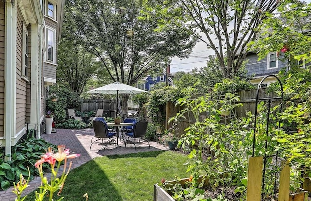 179 Elmgrove Ave, Providence, RI 02906 - fenced backyard with a patio