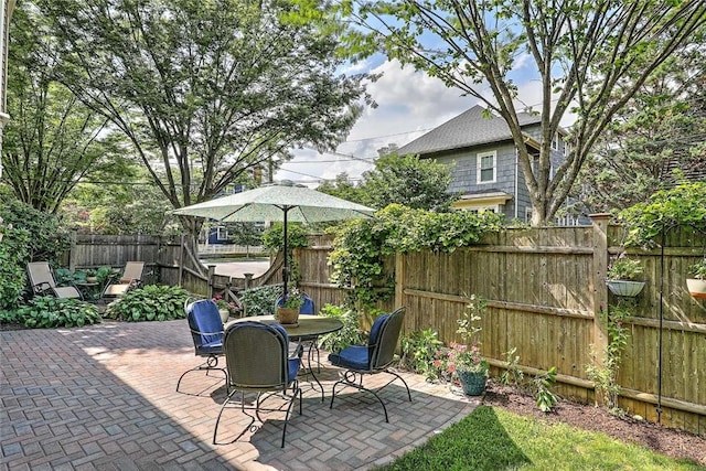 179 Elmgrove Ave, Providence, RI 02906 - fenced backyard featuring a patio area and outdoor dining area