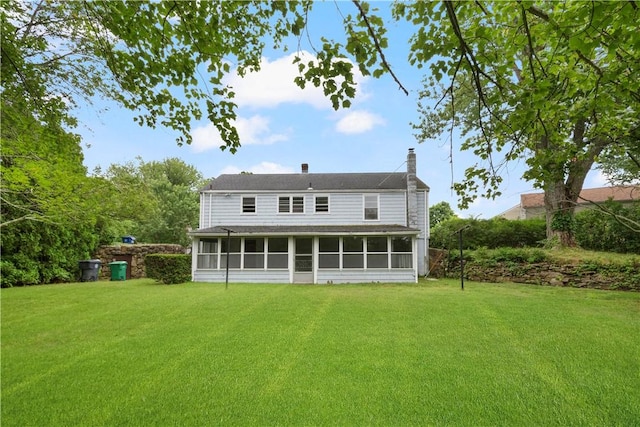 21 Parsonage Dr, Warwick, RI 02889 - back of property featuring a sunroom, a yard, and a chimney