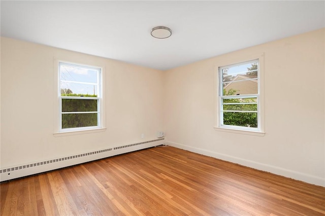 21 Parsonage Dr, Warwick, RI 02889 - unfurnished room featuring baseboard heating and light wood-style floors