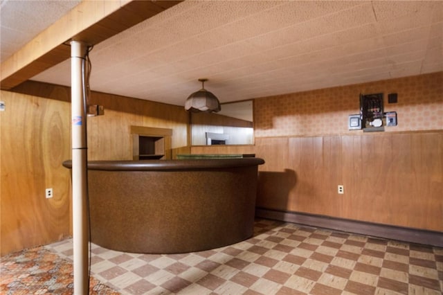 21 Parsonage Dr, Warwick, RI 02889 - bar featuring tile patterned floors, wood walls, and a wainscoted wall