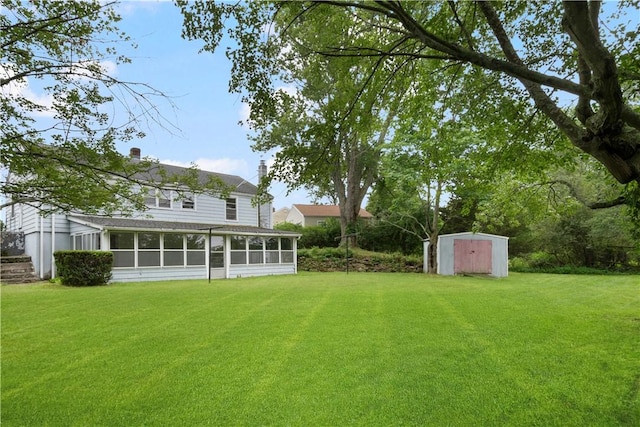 21 Parsonage Dr, Warwick, RI 02889 - view of grassy yard with a storage unit and a sunroom
