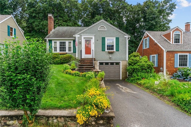13 Welcome Rd, Smithfield, RI 02917 - view of front facade with a chimney, driveway, an attached garage, and a front yard