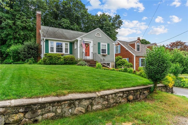 13 Welcome Rd, Smithfield, RI 02917 - view of front of house with a chimney and a front lawn