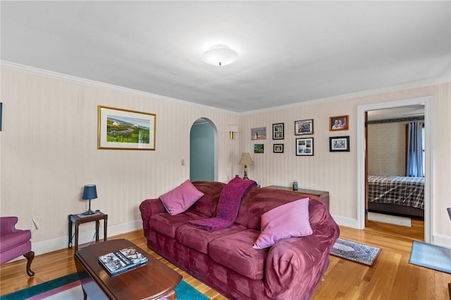 13 Welcome Rd, Smithfield, RI 02917 - living room featuring arched walkways, wood finished floors, and ornamental molding