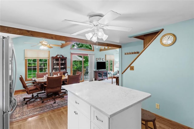 13 Welcome Rd, Smithfield, RI 02917 - kitchen with freestanding refrigerator, light wood-style floors, a ceiling fan, and white cabinets