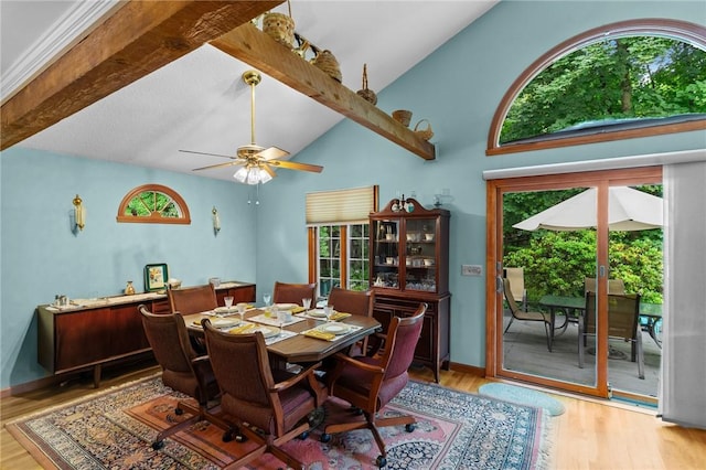 13 Welcome Rd, Smithfield, RI 02917 - dining space featuring plenty of natural light, wood finished floors, beam ceiling, ceiling fan, and high vaulted ceiling