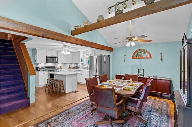 13 Welcome Rd, Smithfield, RI 02917 - dining space featuring a ceiling fan, light wood-type flooring, and stairs