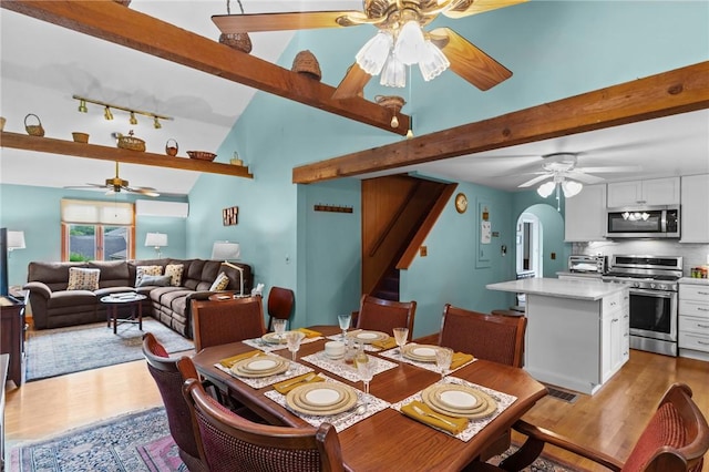 13 Welcome Rd, Smithfield, RI 02917 - dining area with a ceiling fan, wood finished floors, beamed ceiling, track lighting, and stairs