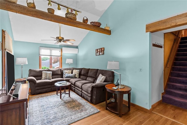 13 Welcome Rd, Smithfield, RI 02917 - living area featuring wood finished floors, beamed ceiling, stairs, ceiling fan, and a wall mounted AC