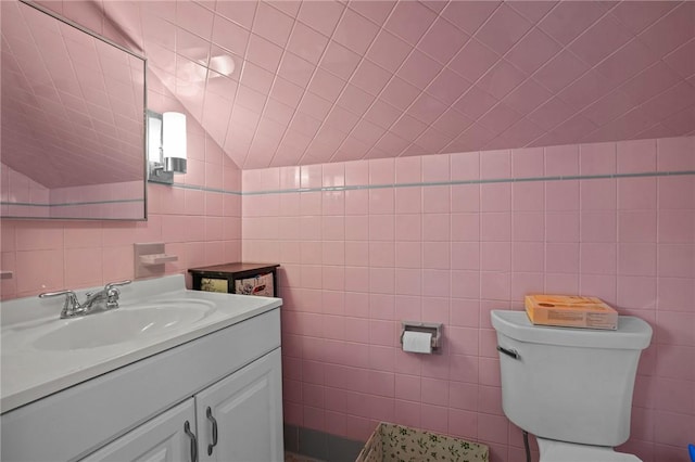 13 Welcome Rd, Smithfield, RI 02917 - half bath with tile walls, vanity, and lofted ceiling