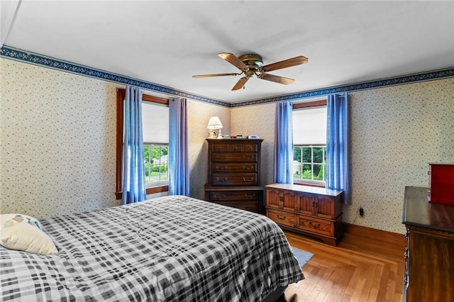 13 Welcome Rd, Smithfield, RI 02917 - bedroom featuring wallpapered walls, multiple windows, and a ceiling fan