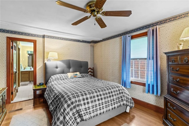 13 Welcome Rd, Smithfield, RI 02917 - bedroom with light wood finished floors, wallpapered walls, a ceiling fan, and ensuite bath