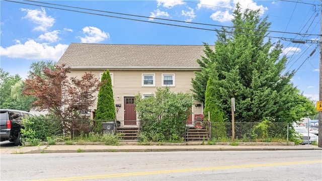 65 River St, West Warwick, RI 02893 - view of front of house featuring a fenced front yard