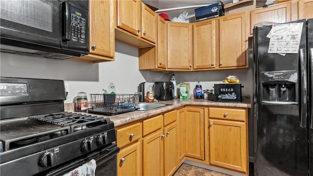65 River St, West Warwick, RI 02893 - kitchen featuring black appliances and light countertops