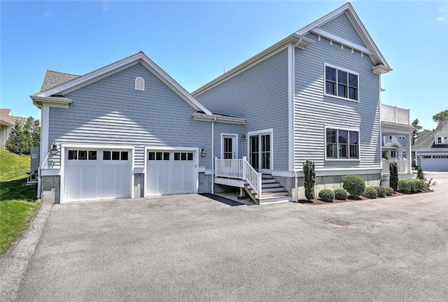 20 Kettle Point Ave, East Providence, RI 02914 - view of front of house with driveway and an attached garage