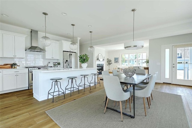 20 Kettle Point Ave, East Providence, RI 02914 - dining space with light wood-type flooring, crown molding, and recessed lighting
