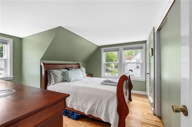 23 Preston Dr, North Kingstown, RI 02852 - bedroom with multiple windows, light wood-type flooring, and vaulted ceiling