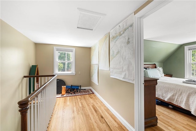 23 Preston Dr, North Kingstown, RI 02852 - hall with wood finished floors, healthy amount of natural light, attic access, and lofted ceiling