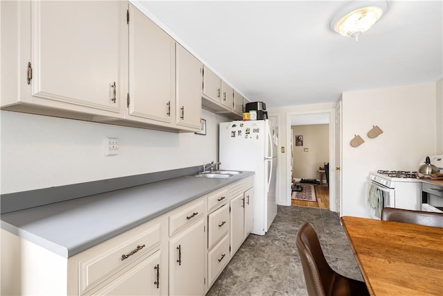 23 Preston Dr, North Kingstown, RI 02852 - kitchen with white appliances, light countertops, and white cabinets