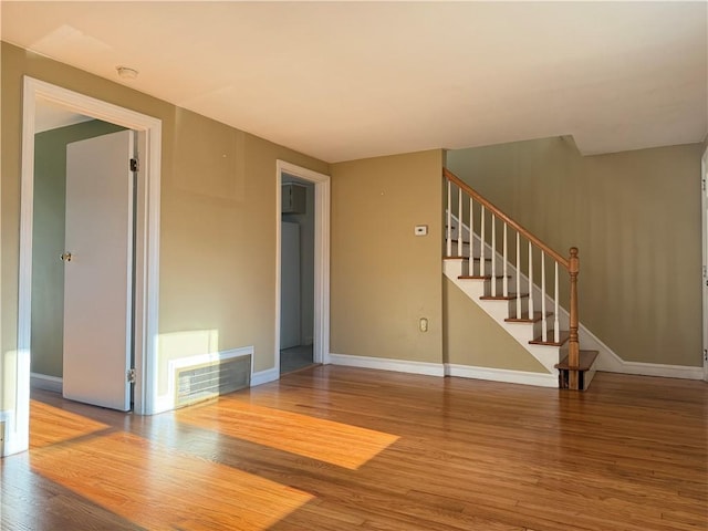 23 Preston Dr, North Kingstown, RI 02852 - unfurnished room with wood finished floors, stairway, and a smoke detector