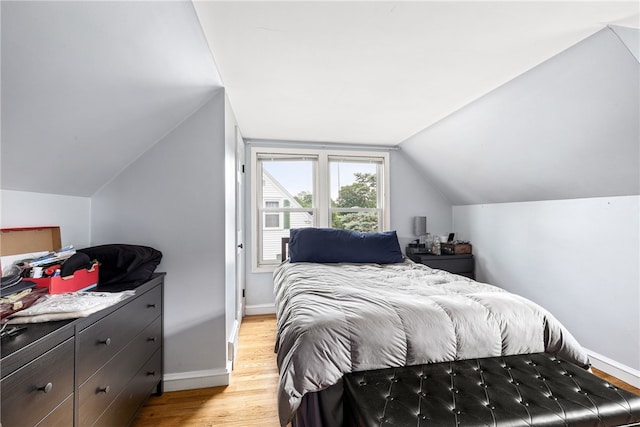 23 Preston Dr, North Kingstown, RI 02852 - bedroom with light wood-style flooring and lofted ceiling