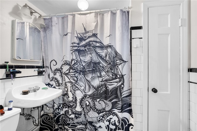 23 Preston Dr, North Kingstown, RI 02852 - bathroom with tile walls and a shower with shower curtain