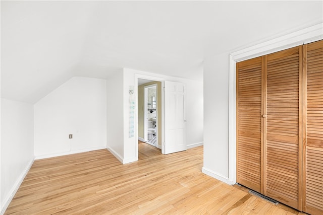 15 Preston Dr, North Kingstown, RI 02852 - additional living space featuring light wood-type flooring and vaulted ceiling