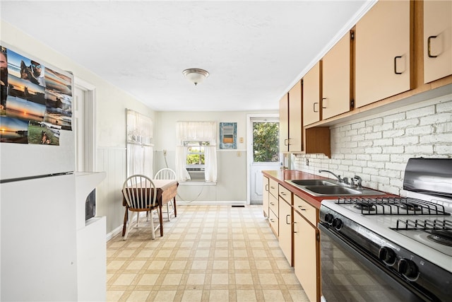 15 Preston Dr, North Kingstown, RI 02852 - kitchen with gas stove, freestanding refrigerator, decorative backsplash, light floors, and cooling unit