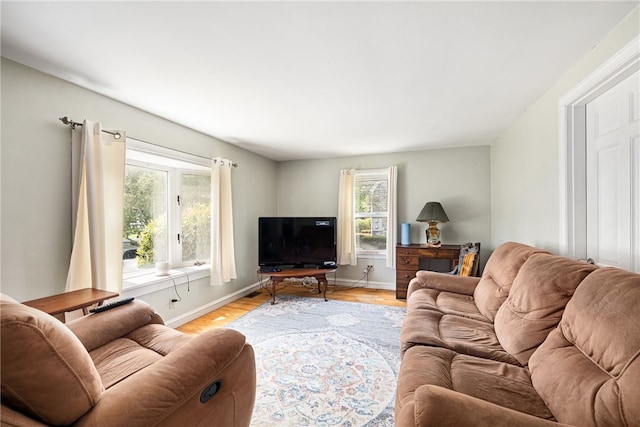 15 Preston Dr, North Kingstown, RI 02852 - living room with baseboards and light wood finished floors