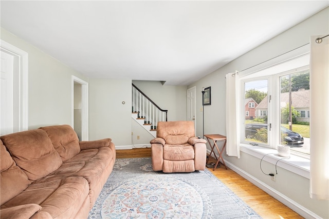 15 Preston Dr, North Kingstown, RI 02852 - living area featuring stairs and wood finished floors