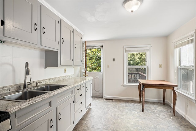 15 Preston Dr, North Kingstown, RI 02852 - kitchen featuring light countertops, tasteful backsplash, and black electric range