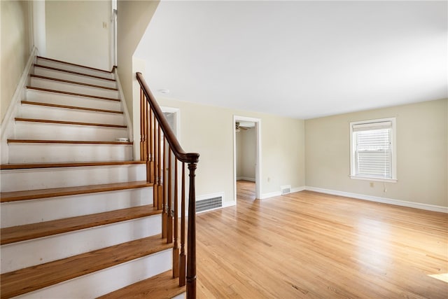 15 Preston Dr, North Kingstown, RI 02852 - stairs featuring wood finished floors and baseboards