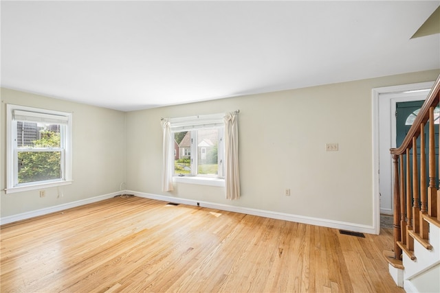 15 Preston Dr, North Kingstown, RI 02852 - unfurnished room featuring healthy amount of natural light, stairway, and wood finished floors