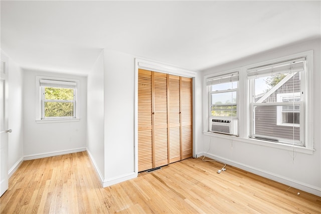 15 Preston Dr, North Kingstown, RI 02852 - unfurnished bedroom featuring light wood finished floors, a closet, and cooling unit