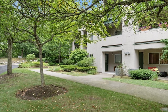 31 Devereux Ave Unit 115, Providence, RI 02909 - view of front of house featuring stucco siding