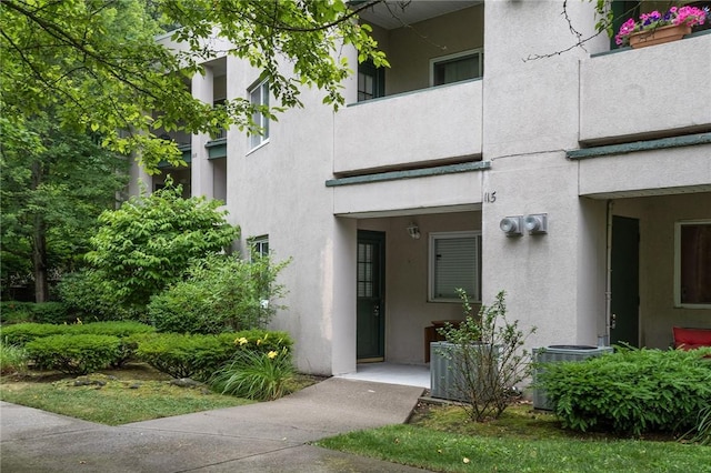 31 Devereux Ave Unit 115, Providence, RI 02909 - view of exterior entry featuring stucco siding