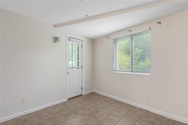 31 Devereux Ave Unit 115, Providence, RI 02909 - empty room with beamed ceiling and light tile patterned flooring