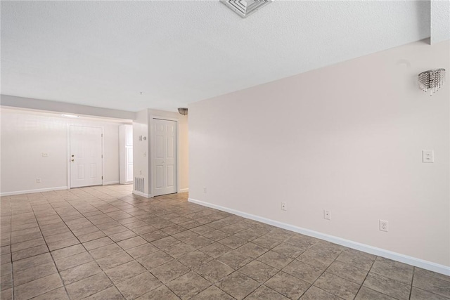 31 Devereux Ave Unit 115, Providence, RI 02909 - empty room featuring a textured ceiling and light tile patterned floors