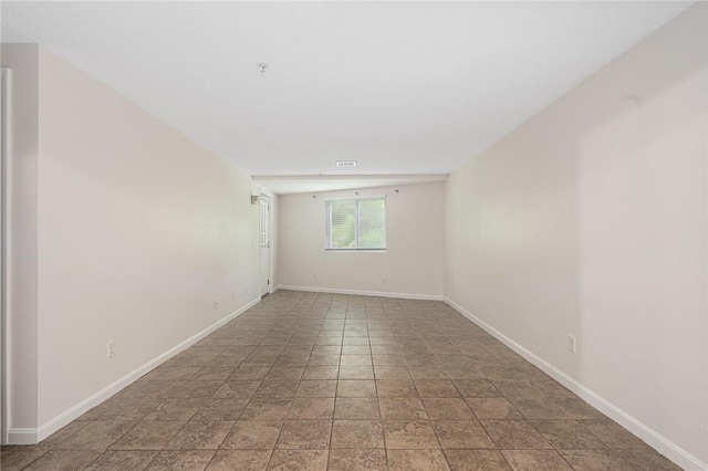 31 Devereux Ave Unit 115, Providence, RI 02909 - empty room featuring baseboards and light stone finish flooring