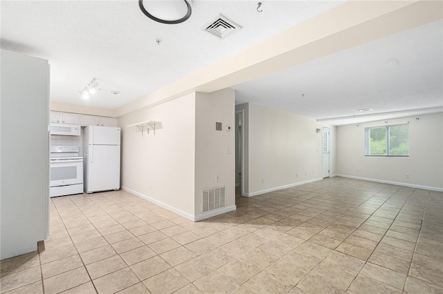31 Devereux Ave Unit 115, Providence, RI 02909 - empty room with light tile patterned floors and a pendent fire sprinkler
