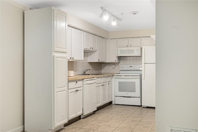 31 Devereux Ave Unit 115, Providence, RI 02909 - kitchen featuring white appliances, decorative backsplash, light countertops, and white cabinetry