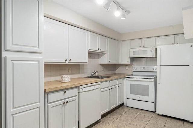 31 Devereux Ave Unit 115, Providence, RI 02909 - kitchen featuring white appliances, white cabinetry, backsplash, and light countertops