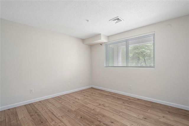 31 Devereux Ave Unit 115, Providence, RI 02909 - empty room featuring wood finished floors and a textured ceiling