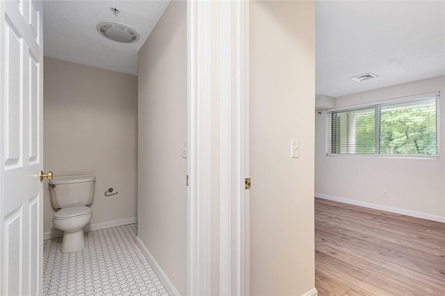 31 Devereux Ave Unit 115, Providence, RI 02909 - bathroom featuring toilet and baseboards